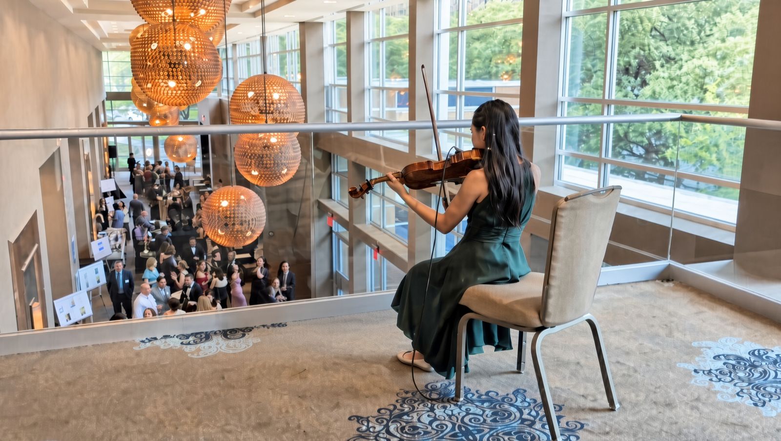 Violin performance overlooking a gala reception