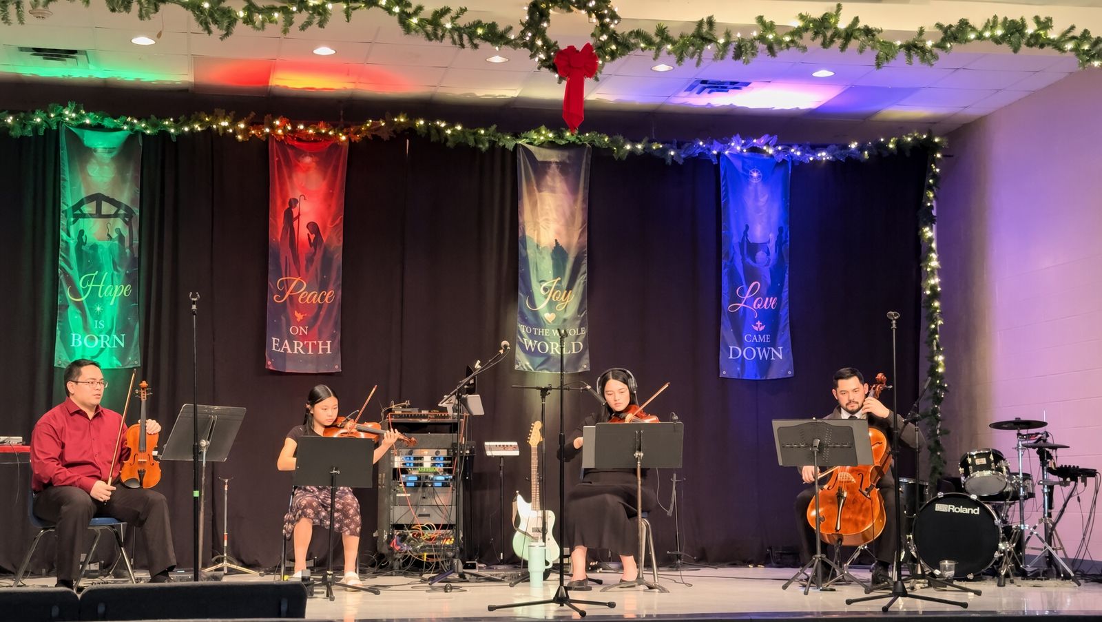 String quartet performing at a Christmas event