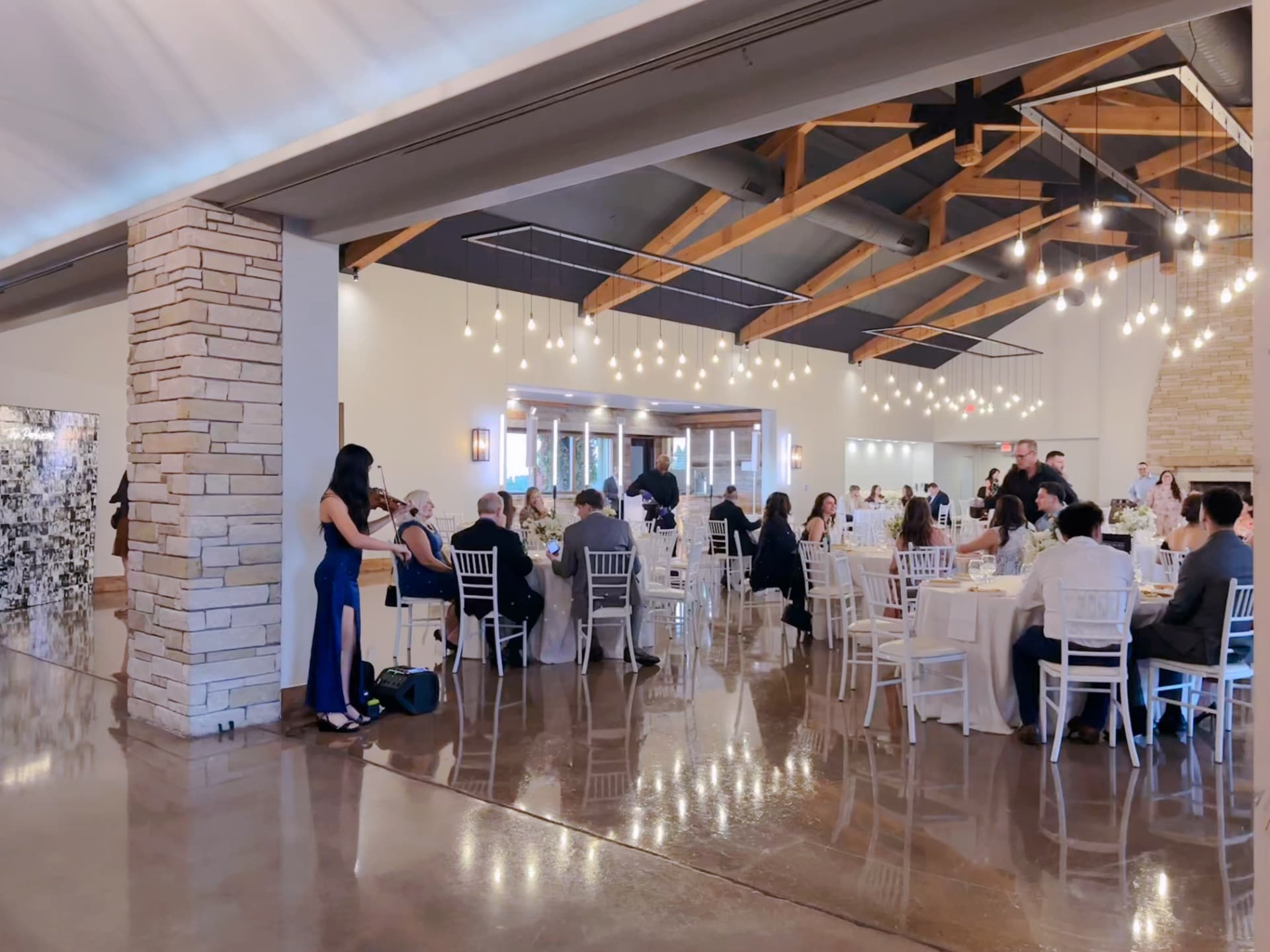 Elegant violin performance during a wedding reception dinner